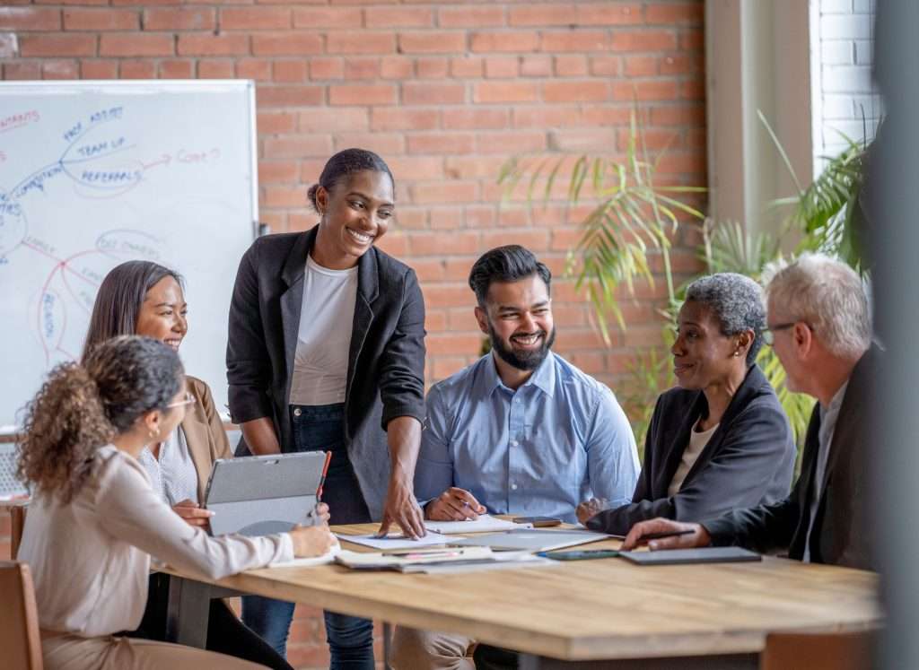 Six People Meeting About Fractional CFO Services